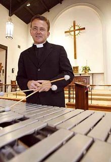 The Rev. Norm Freeman includes a vibe performance Sunday during his service at St. George's Episcopal Church in Laguna Hills.