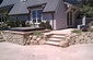 hot tub built into custom sandstone walls and stairs