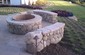 custom stone fire pit and benches