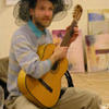 Der_k_nstler_mit_gitarre_thumb