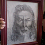 Native_american_man_drawing_card
