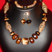 Bone_kukui_nut__brass_beads_card