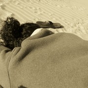 Lyssa_sleeping_on_beach_in_my_coat_card