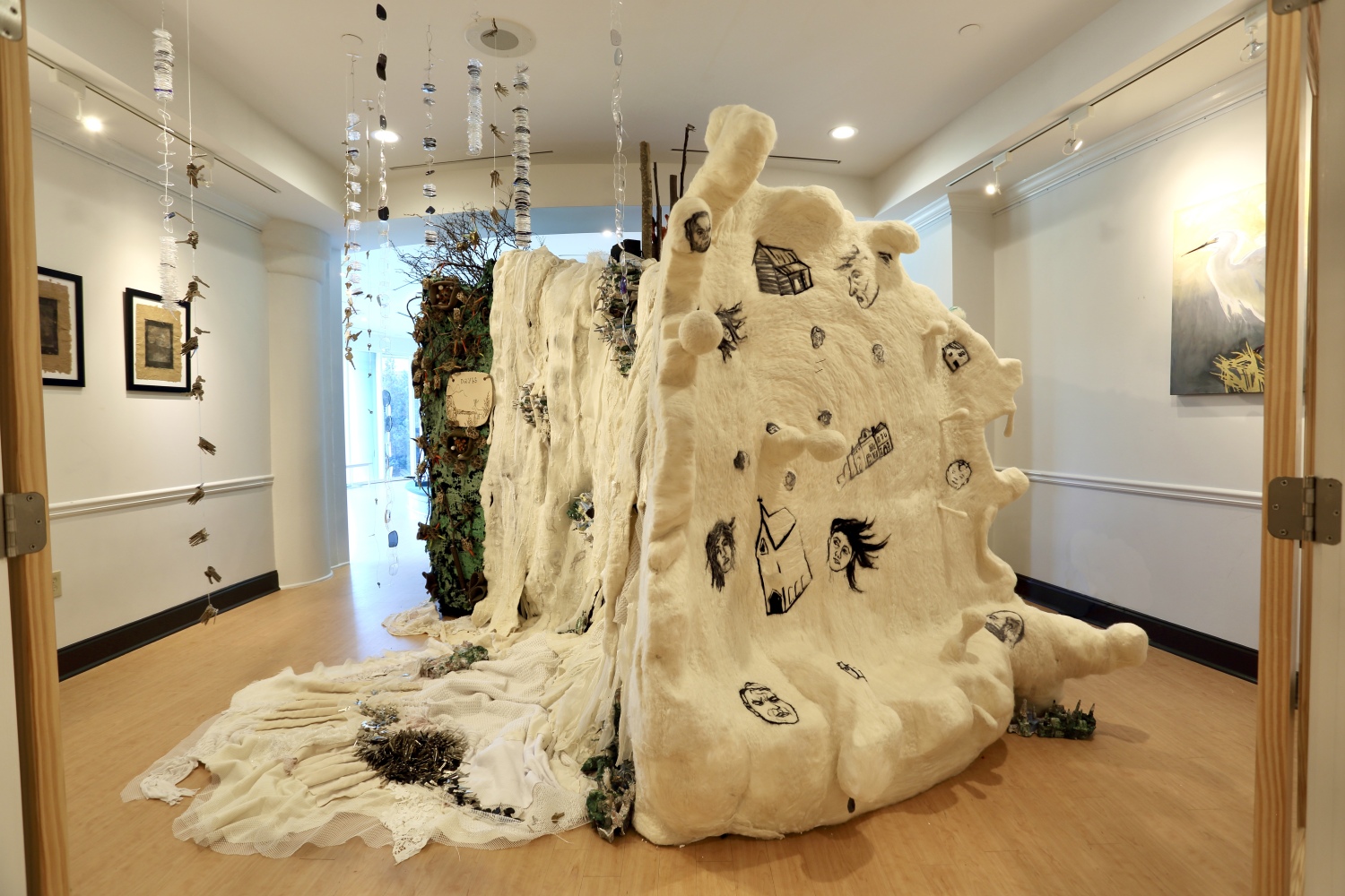 A large climate crisis art installation made of fiber and post consmer plastic by Kim Keelor