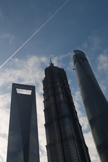Limits on supertalls, like the 492-meter Shanghai World Financial Center (left) are among the topics being discussed in a round of new legislation changes released in China.
