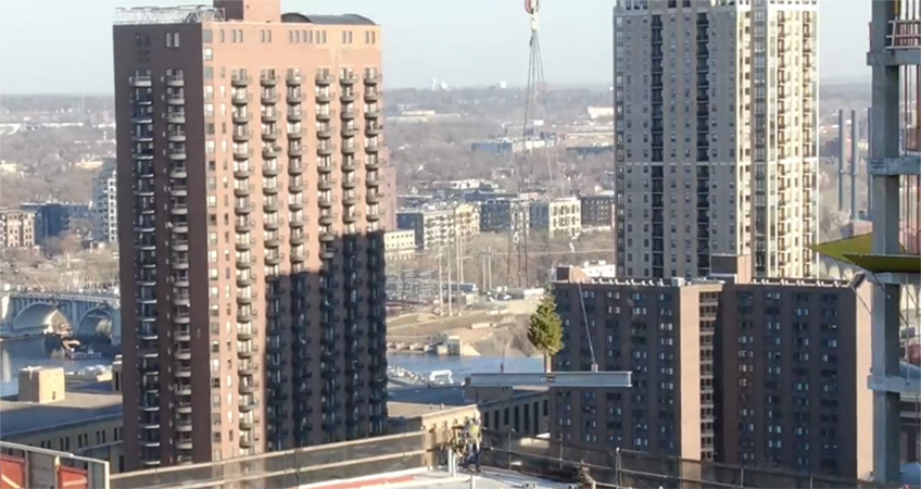 Video footage shows the 22-story building topping out.