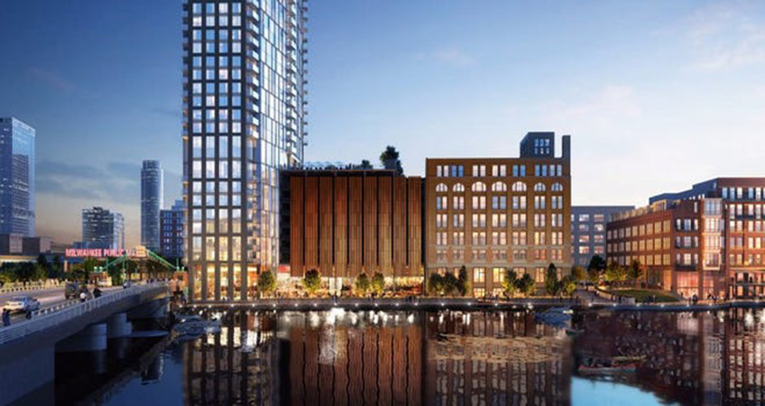 Located at the entrance to the Third Ward, 333 N. Water in Milwaukee sits directly on the bank of the Milwaukee River. Image credit: Solomon Cordwell Buenz