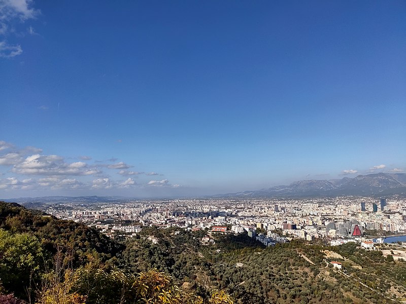 View of Tirana from the position of the Sauk Lapidar. Image by Terfili, CC BY-SA 4.0 <https://creativecommons.org/licenses/by-sa/4.0>, via Wikimedia Commons