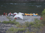 Camp_with_boats_on_bank