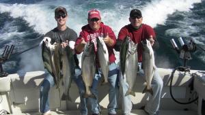 Photo of Mike James and company.    Caption...... Mike James and friends with a great catch of Salmon and Trout! <br> <br><br>Let's go fishing!! Jim charters out of Milwaukee, WI. with Blue Max Charters. He can be reached at 414-828-1094 or visit his web site at http://www.bluemaxcharters.com Copyright© 2010, James J. Hirt, All Rights Reserved.<br><br>