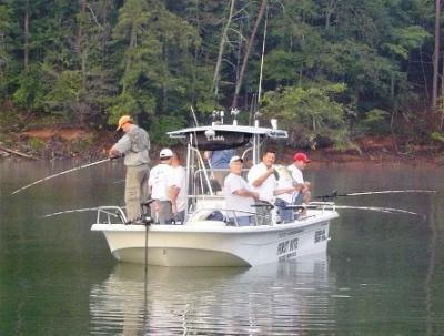 FIRST BITE GUIDE SERVICE.<br>www.firstbiteguideservice.com<br>Striped and Hybrid Bass.<br>770 827-6282<br>