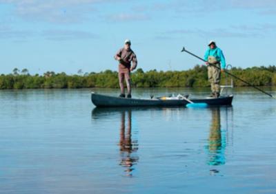 The poling canoe fishing machin in action. <br>John Kumiski<br>spottedtail@spottedtail.com