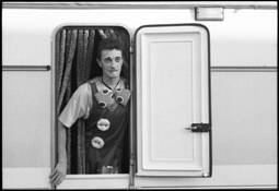 Clown_looking_out_from_his_trailer