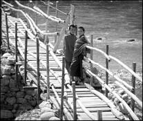 Two_monks_on_bamboo_bridge