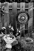 Sun_medallion_with_fence_and_ceramic_bowl