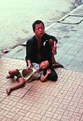 Crippled_beggar_with_child