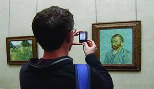 Man_photographing_painting
