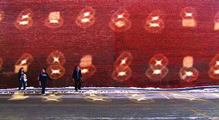 Women_and_circles_on_brick_wall