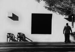 Man_and_chairs