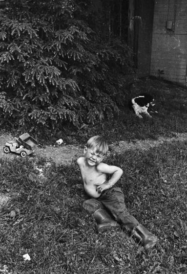 Boy_on_grass_with_toy_truck