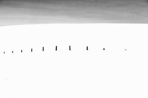 The_fence_between_snow_and_sky