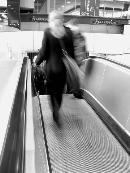 Woman_on_esculator