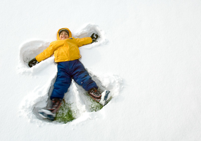 A child makes an angel in the freshly fallen snow at a park in Madison, Wisconsin. Large