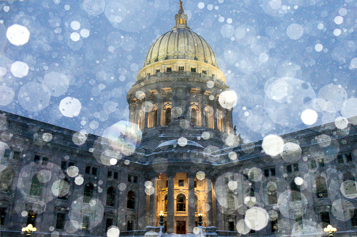 Snow falls over the Wisconsin state capitol in Madison. Large