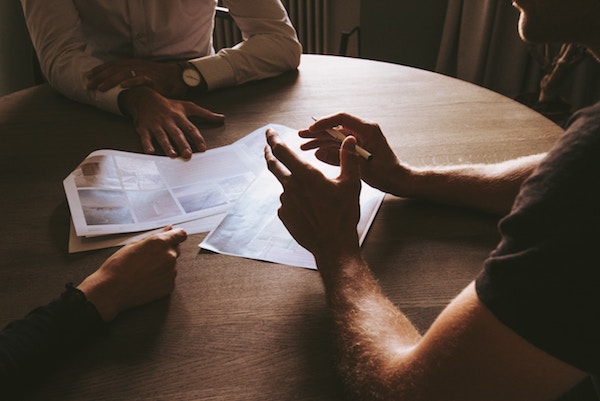 Three people meeting at a table