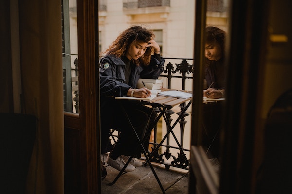 A writer sitting at a table