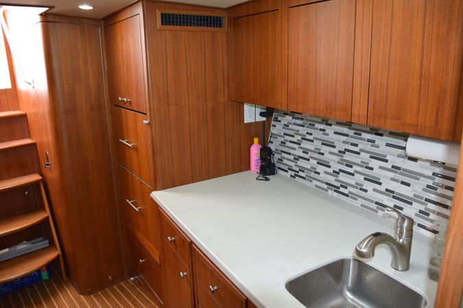 Galley Counter with Glass Tile Backsplash