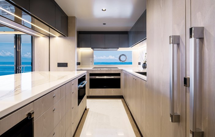 Galley with refridgerator and island.