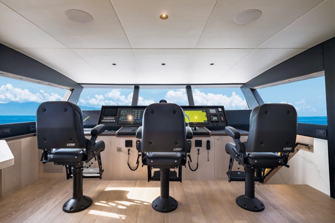 Skylounge helm with 3 captains chairs.