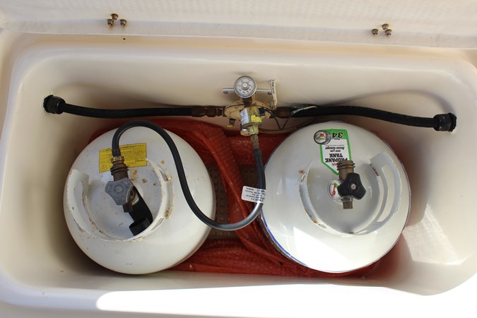 Propane tank stowage locker