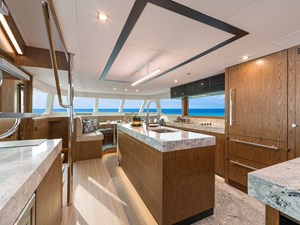 Horizon V68-612 galley with center island and panal-ready fridge.