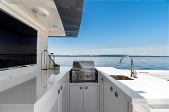Horizon V68-Hull 12 boat deck with bar and grill.