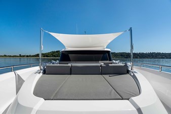 Horizon V68-Hull 12 large bow seating area and sunpad.