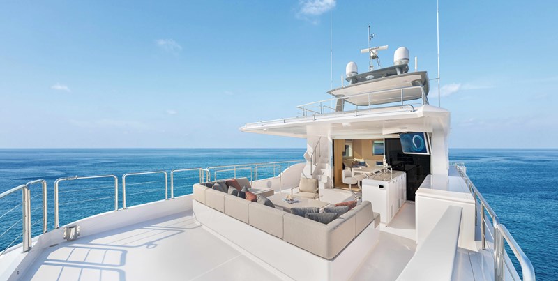 Horizon FD110 Hull 7 Boat Deck with room for tender and l shaped seating.