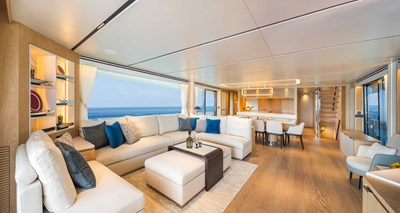 Horizon FD110 Hull 7 forward facing large salon with sofa and coffee table.