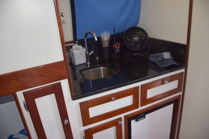 Galley with granite countertop, stainless sink