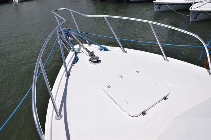 Aluminum bow rail and solid fiberglass deck hatch