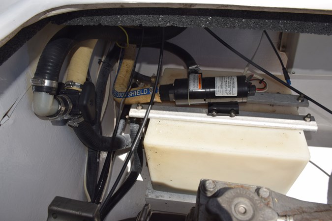 Holding tank outboard of starboard motor