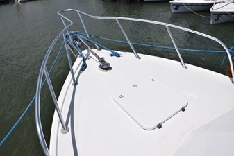 Aluminum bow rail and solid fiberglass deck hatch