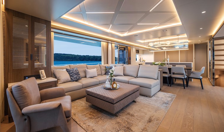 Horizon FD90 Hull 34 forward facing salon with sofa and chair.