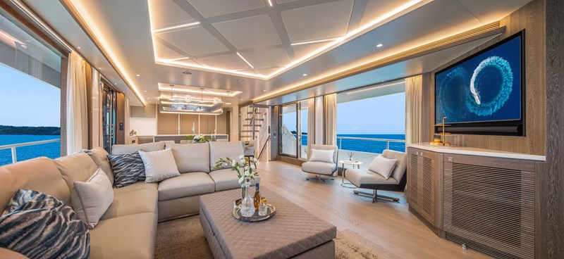 Horizon FD90 Hull 34 open salon with large windows and TV.