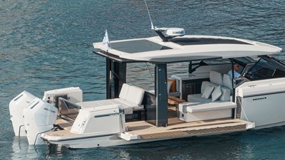 Modern Saxdor 400 GTO yacht with open aft deck, lounge seating, and twin Mercury outboard engines
