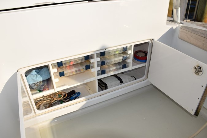 Tackle storage center in cockpit