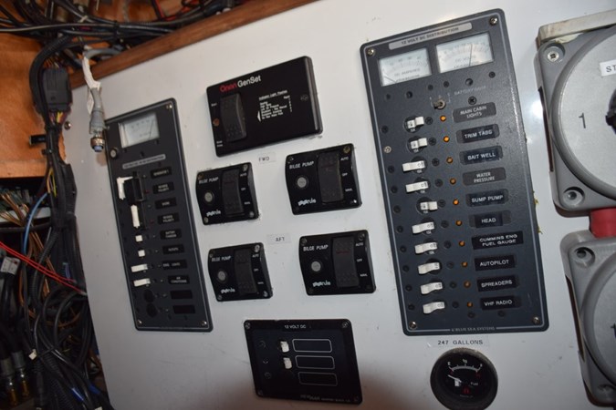 Breaker panel, shore powergen switching, bilge pump monitors and fuel gauge (beneath console)