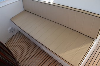 Companion bench seating forward of helm