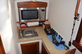 Galley area to starboard, Corian countertop, stainless steel sink